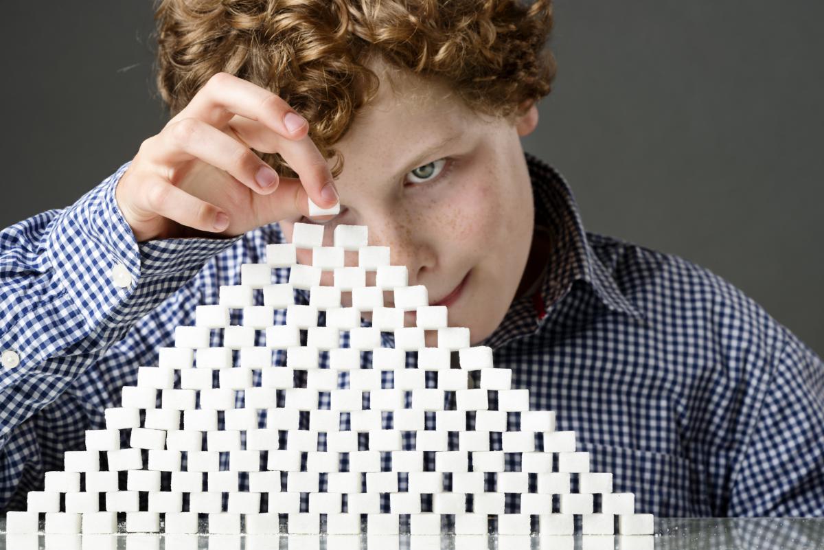 child building with sugar blocks